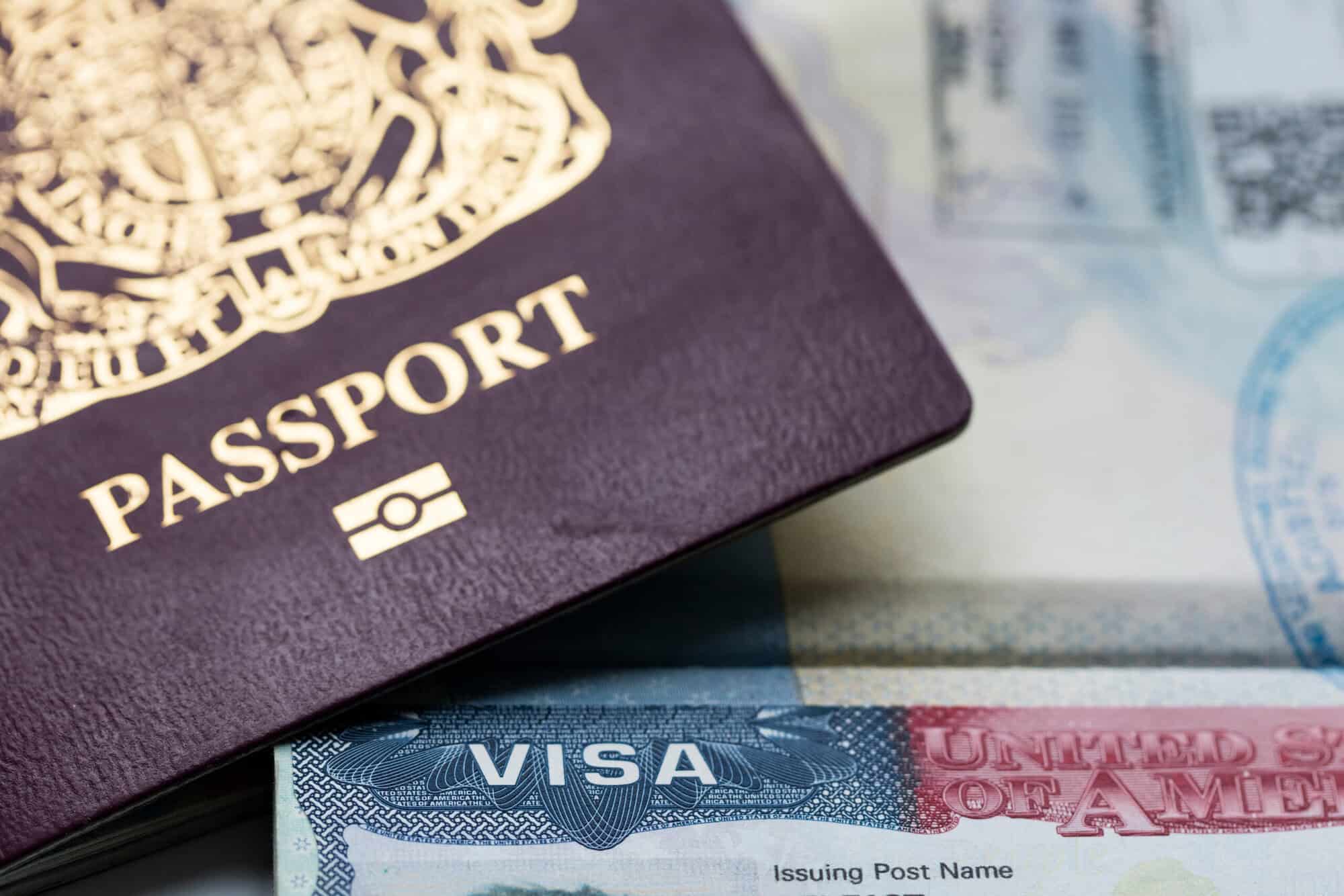 A close-up of a passport over a U.S. visa page, ideal for immigration visa lawyers or a deportation law firm showcasing legal expertise.