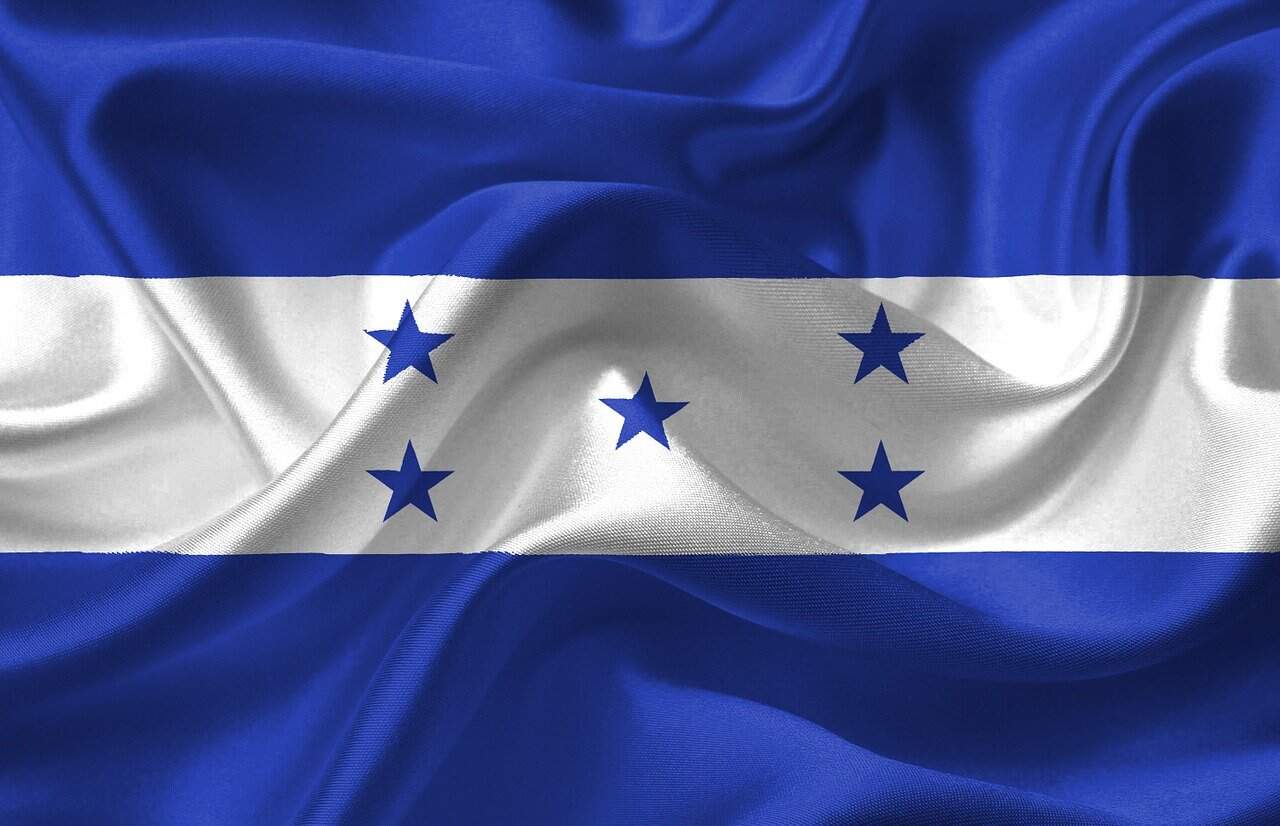 The flag of Honduras features three stripes and five blue stars in an X, like banners in a criminal defense lawyers Louisiana office.
