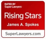 A red and white badge reads "Rising Stars, James A. Spokes," honoring James A. Spokes with "SuperLawyers.com" at the bottom.