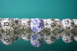 White and blue-numbered balls rest on a reflective surface, echoing the precision found in top Louisiana immigration lawyers.