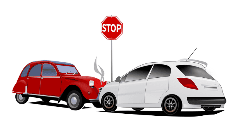 A red vintage car and a white modern car have collided; criminal defense lawyers Louisiana are on the scene amid billowing smoke.
