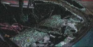 Shattered glass covers the interior of a damaged vehicle; personal injury lawyers Louisiana can help after such accidents.