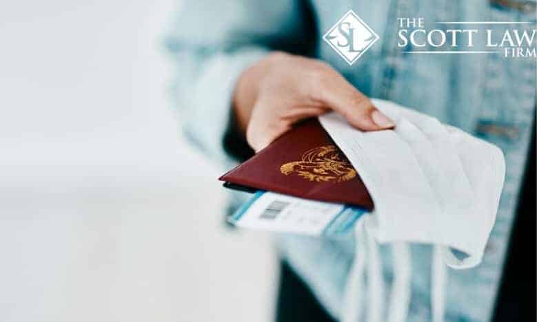 A person holds a passport, boarding pass, and face mask; "The Scott Law Firm," a leading Louisiana immigration lawyers, logo is top right.